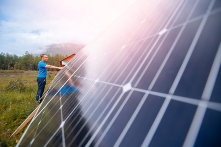 Young male engineer installation and operation solar panels. Concept preparing energy electrical...
