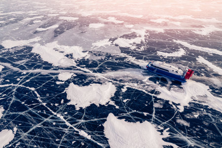 Hovercraft rides on clear ice of Lake Baikal winterの写真素材