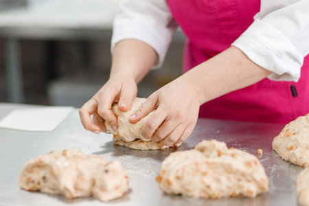 Step-by-step Easter cake, pastry chef prepares dough with raisins for festive kulich