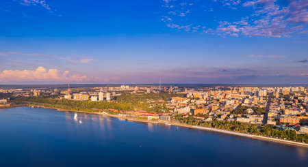 Aerial top view panorama city Perm and central embankment of Kama river Russia, sunset drone photoの写真素材