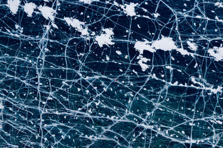 Alone Woman tourist background texture of blue ice with cracks, aerial top view of Lake Baikalの写真素材
