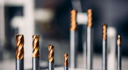 Closeup drill bit set for CNC machine cutting sheet metal, Industrial bannerの写真素材