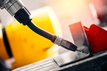 Industrial arm robot CNC automatic welding metal production in factoryの写真素材