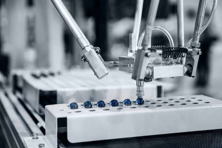 Automatic arm for moving individual parts in industrial production plantの写真素材