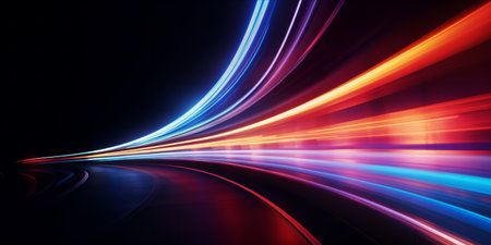 Long exposure of colorful light trails in motion on a dark background.の素材