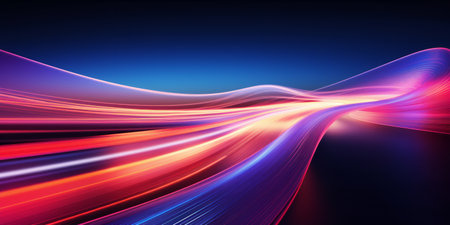 Long exposure of colorful light trails in motion on a dark background.の素材