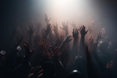 A crowd of people reaching upwards in a misty, eerie atmosphereの素材