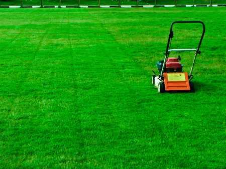 a stopped mower at a yard の写真素材