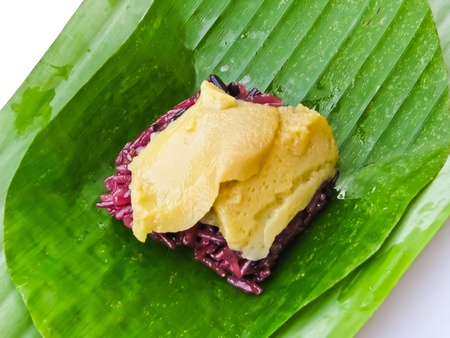 sweet sticky rice with egg custard toppingの写真素材