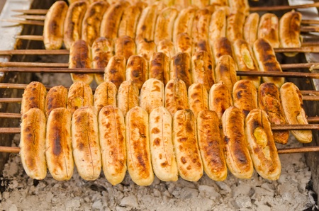 row of grilled banana on hot ovenの写真素材