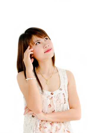 cute girl thinking about something on white backgroundの写真素材