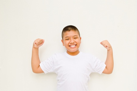 strong and happy asian boy on white backgroundの写真素材