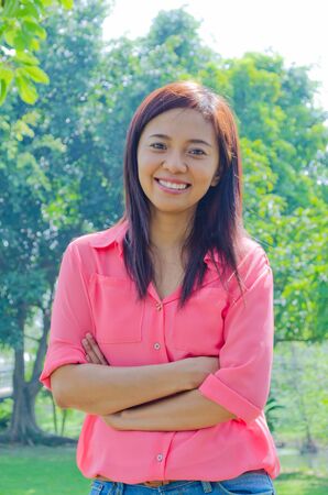 Thai happy woman smiling in parkの写真素材