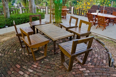 wood chairs and table setting in garden at resortのeditorial素材