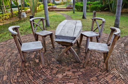 wood chairs and table setting in garden at resortのeditorial素材