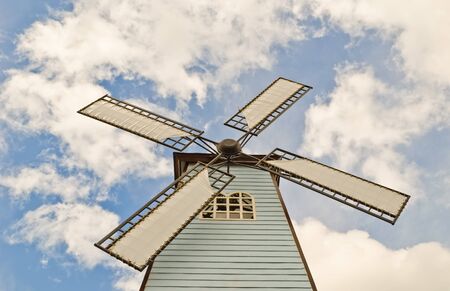 windmill over cloudy skyの写真素材
