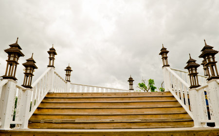 wood stair over gray sky の写真素材