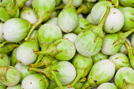 Fresh green eggplant at market の写真素材