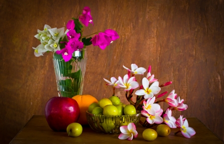 Fresh beautiful flower and many fruit on old wood table ,still lifeの写真素材
