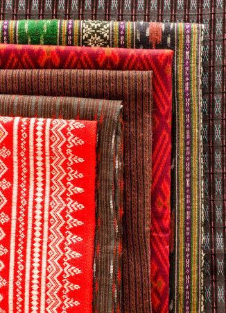 Stack of Thai style fabric at shopの写真素材