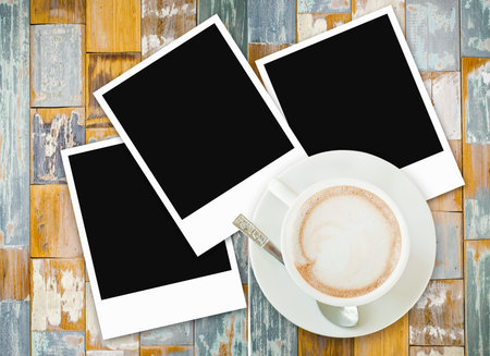 Photo frame and coffee cup on old wood texture background 
