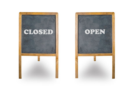 closed and open word write on blackboardの写真素材