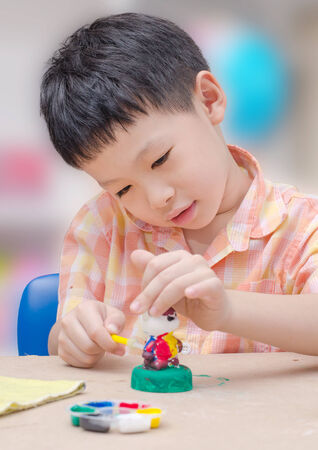 Asian Child painting model at schoolの写真素材