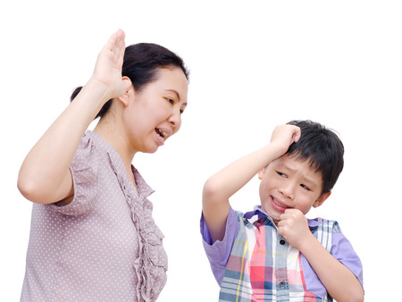 Mother Being Physically Abusive Towards Son Over White Backgroの写真素材