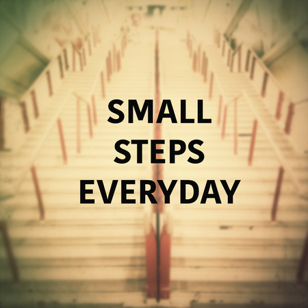 Inspirational quote on blurred staircase background with vintageの写真素材