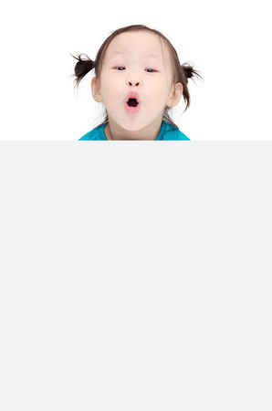 Little asian girl and copy space with surprised faceの写真素材