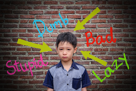 Abusive words hurt on the wallの写真素材