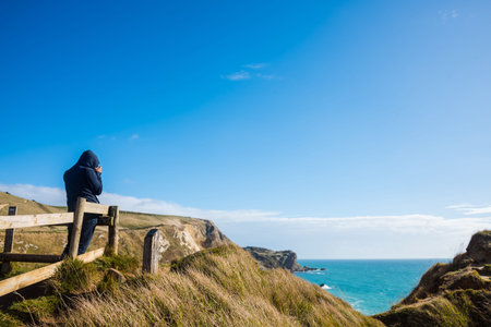 A photographer taking photo on the hillの写真素材