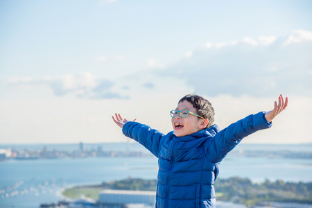 Happy boy on hillの写真素材