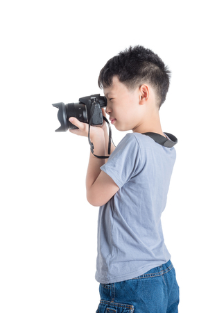boy taking photo by cameraの写真素材
