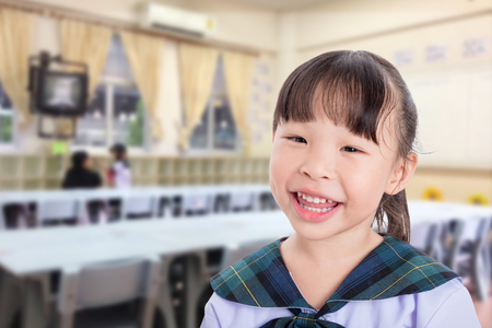 little asian schoolgirl smiling in schoolの写真素材