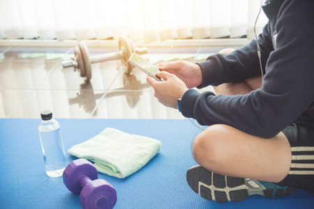 A man using mobile phone after exercise