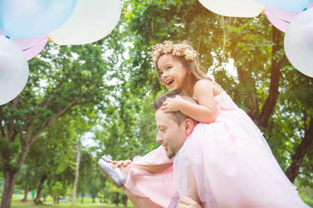 Father and daughter in parkの写真素材