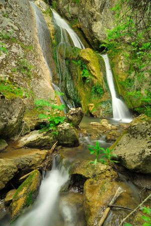 Small waterfall of a mountain creekの写真素材