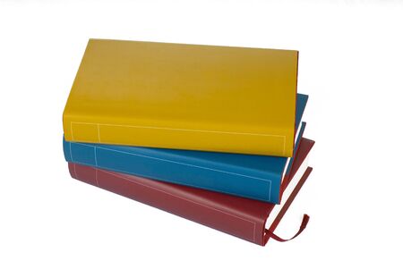 Pile of colourful books on white backgroundの写真素材