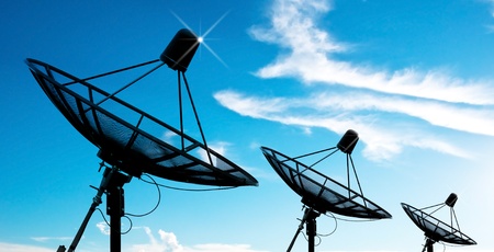 satellite dish antennas under skyの写真素材
