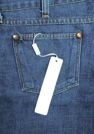 label tied to the blue jeansの写真素材