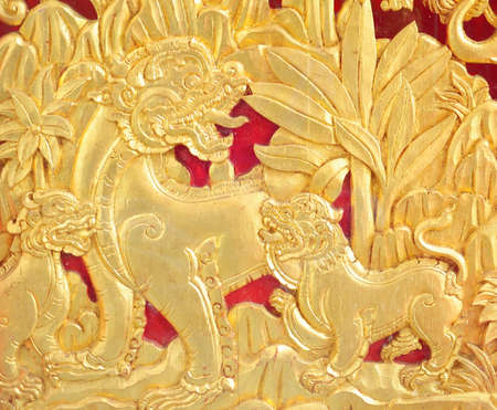 Native Thai style wood carving decorated in temple.  Sculptures in the temple.の写真素材