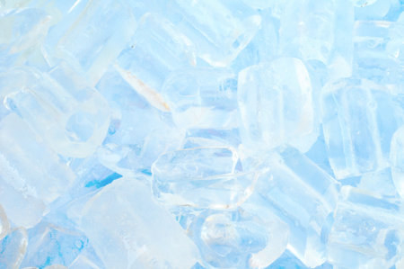 fresh cool ice cube background in blue light