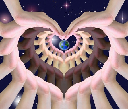 the world in humen hands making a symbol of loveの写真素材