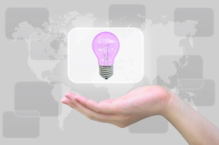 light bulb in women handの写真素材