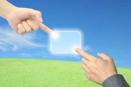 hand pushing a button on a touch screen interfaceの写真素材
