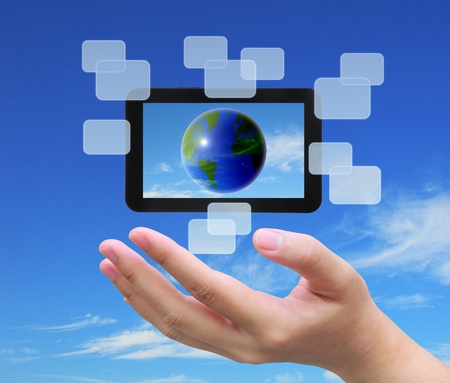 the world in touch pad PC on women handの写真素材