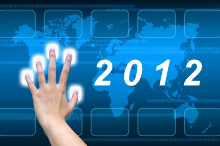 hand pushing 2012 button on a touch screen interfaceの写真素材