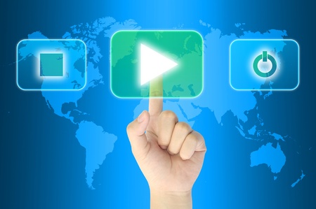 hand pushing media player technology button on a touch screen interfaceの写真素材