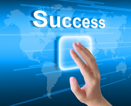 hand pushing success button on a touch screen interface の写真素材